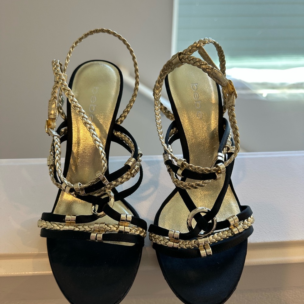 Bebe Elegant Black and Gold Braided Sandals
